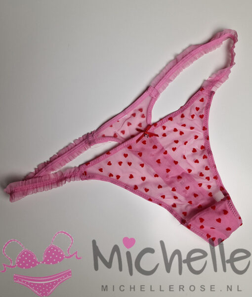 Schattige roze gedragen string met rode hartjes